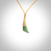 A lovely small sized New Zealand jade drop pendant. This piece is made from a light, green jade. Carved by Ric Moor for NZ Pacific and delivered worldwide. Delivered with adjustable beige cord.
